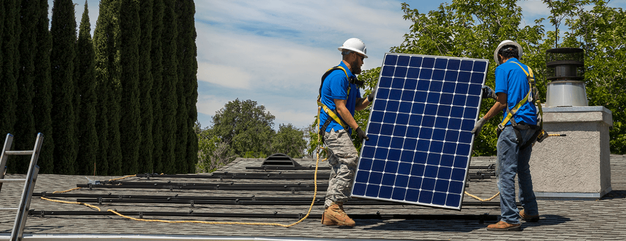 People installing solar panels